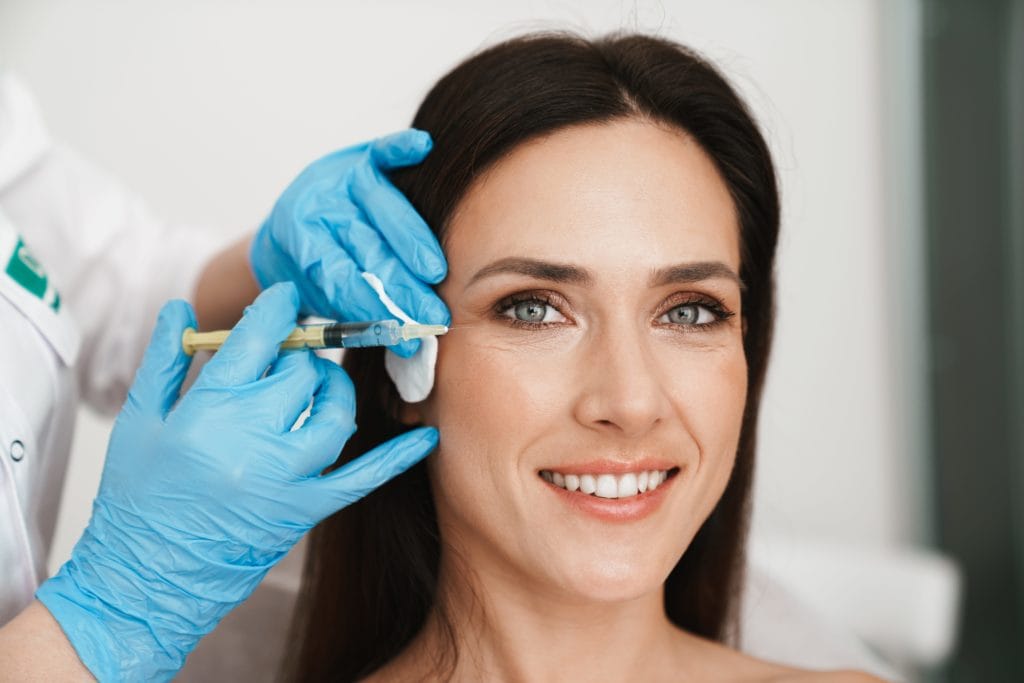A Woman getting injection near the Eye | Anti-Wrinkle Injections in Avon, OH | Willow Boutique Med Spa